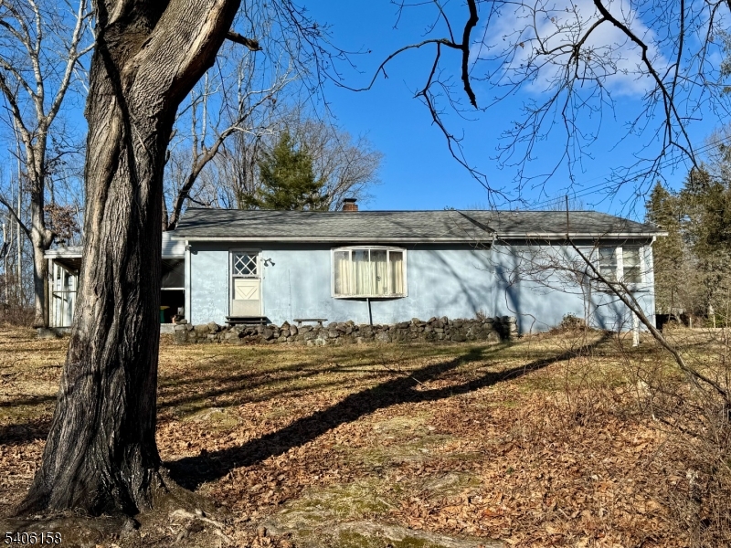 a view of a backyard of the house