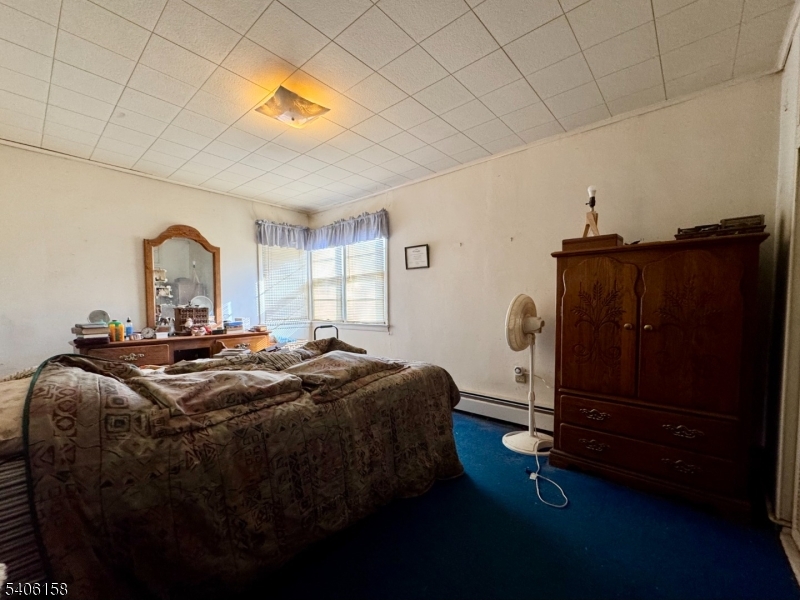 75 Rutherford Drive Belvidere, NJ 07823 - Photo 11 of 16 a bedroom with a bed and a dresser
