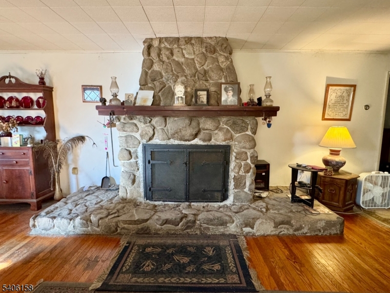 75 Rutherford Drive Belvidere, NJ 07823 - Photo 7 of 16 a bedroom with a bed and a fireplace