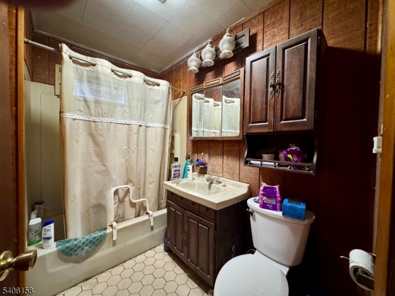 75 Rutherford Drive Belvidere, NJ 07823 - Photo 10 of 16 a bathroom with a sink a toilet and shower curtain