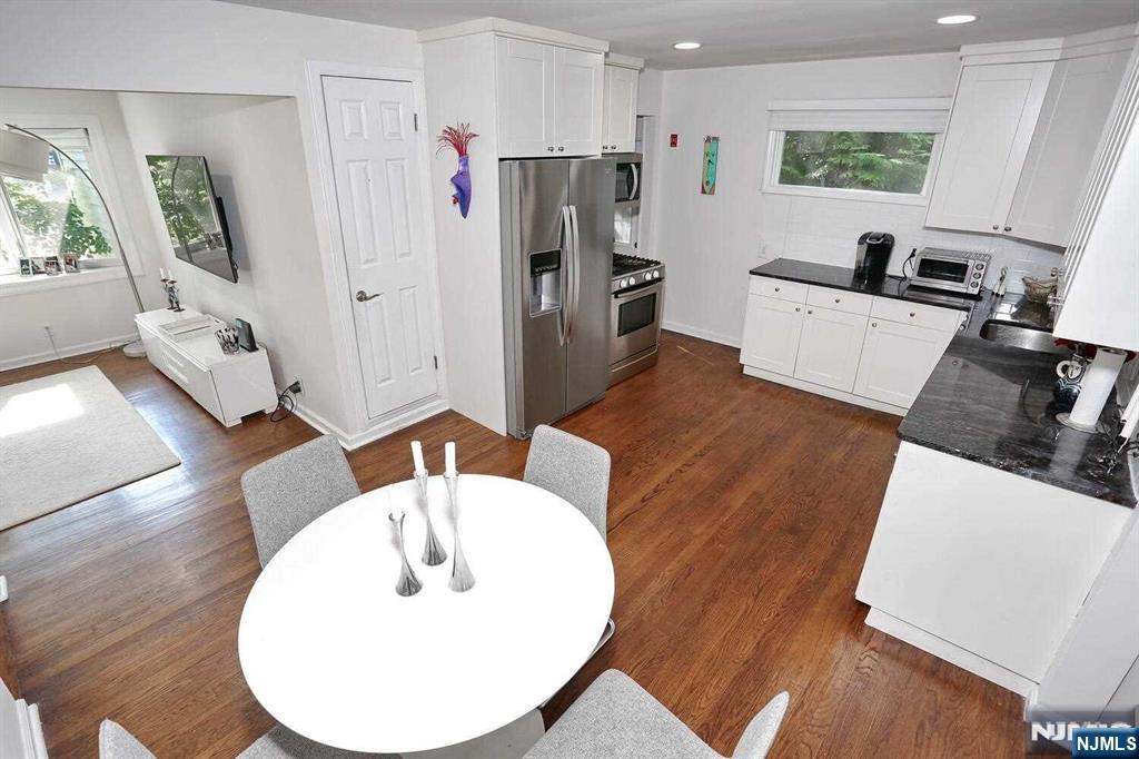 11 Evans Road Cresskill, NJ 07626 - Photo 13 of 31 a living room with furniture and a wooden floor