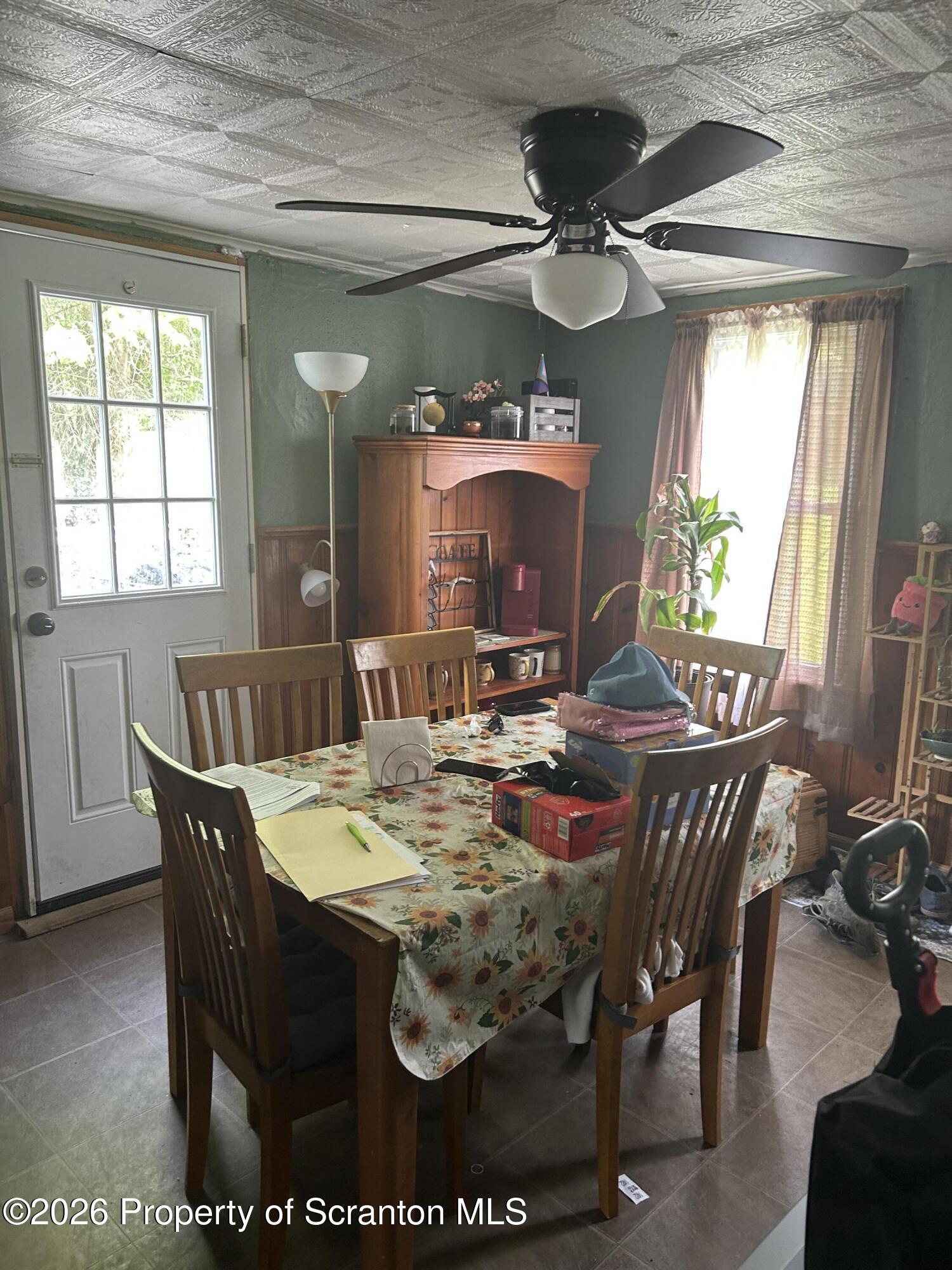 63 Shannon Street Simpson, PA 18407 - Photo 10 of 18 a view of a dining room with furniture and a chandelier