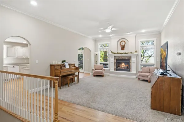 a living room with furniture and a fireplace