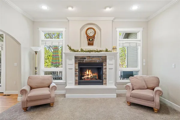 a living room with furniture a dining table and chairs with kitchen view