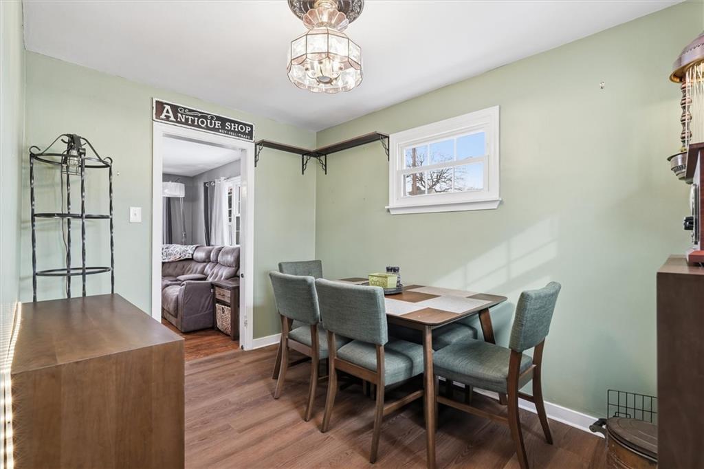 804 Erdner Avenue Pittsburgh, PA 15202 - Photo 11 of 48 a view of a dining room with furniture wooden floor and a chandelier
