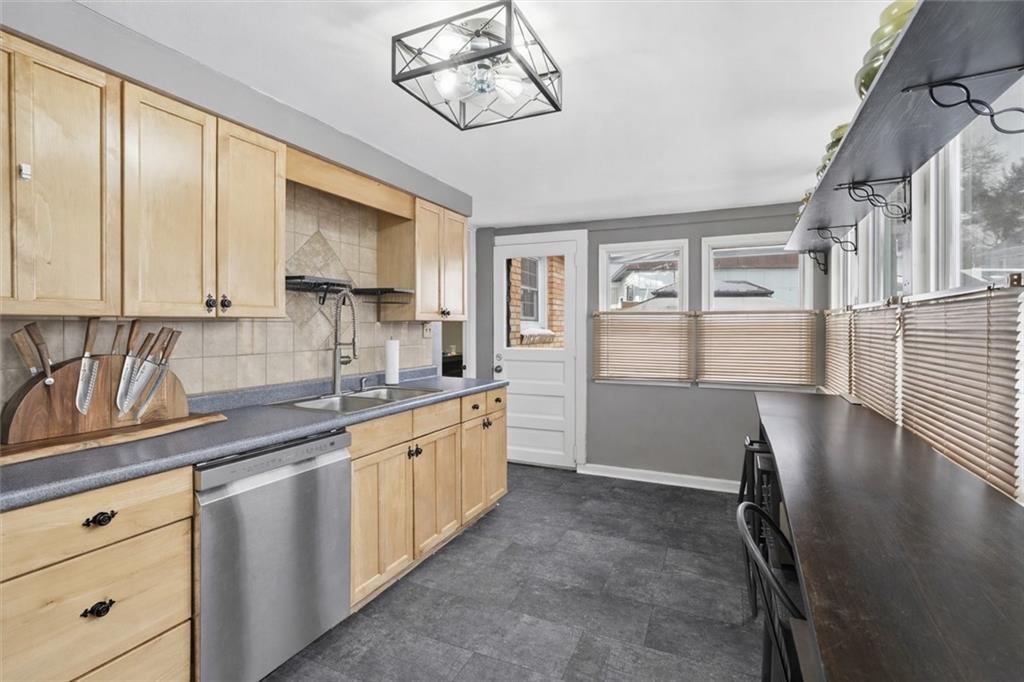 804 Erdner Avenue Pittsburgh, PA 15202 - Photo 14 of 48 a kitchen with stainless steel appliances granite countertop a sink window and cabinets