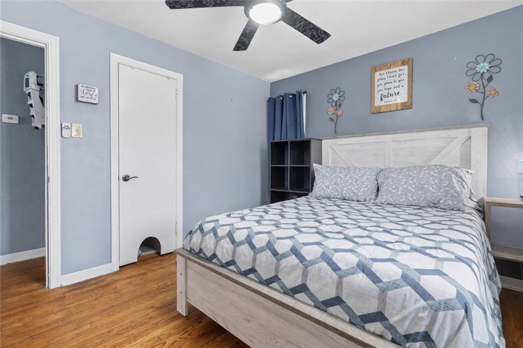804 Erdner Avenue Pittsburgh, PA 15202 - Photo 19 of 48 a bedroom with a bed and painting on the wall
