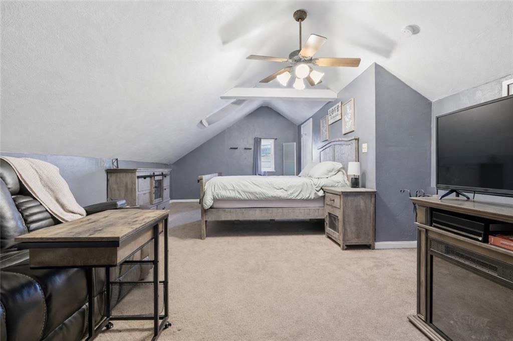 804 Erdner Avenue Pittsburgh, PA 15202 - Photo 22 of 48 a bedroom with a bed and a chandelier
