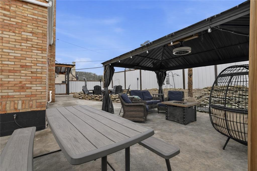 804 Erdner Avenue Pittsburgh, PA 15202 - Photo 35 of 48 a view of a patio with table and chairs and potted plants