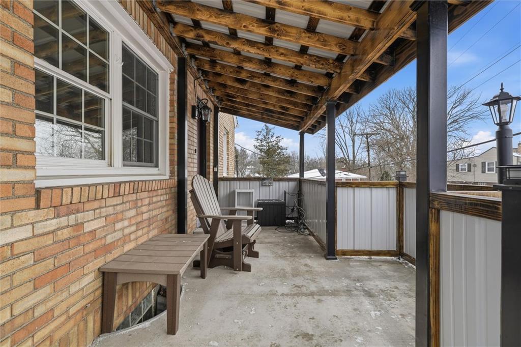 804 Erdner Avenue Pittsburgh, PA 15202 - Photo 4 of 48 a view of a porch with chairs and floor to ceiling window