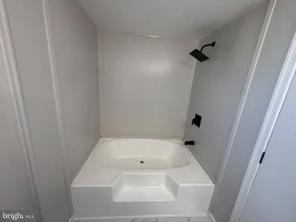 a bathroom with a white bath tub