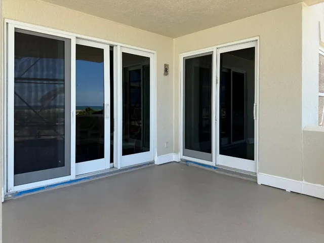 a view of a swimming pool with chairs