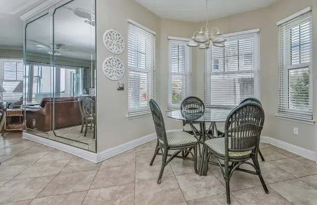 a bedroom with furniture and a chandelier