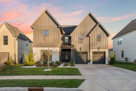 a front view of house with a garden