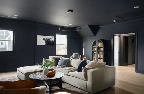 a view of a livingroom with wooden floor and a window