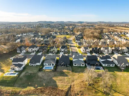 an aerial view of a house with a ocean view