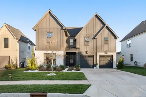 a view of a house and a yard