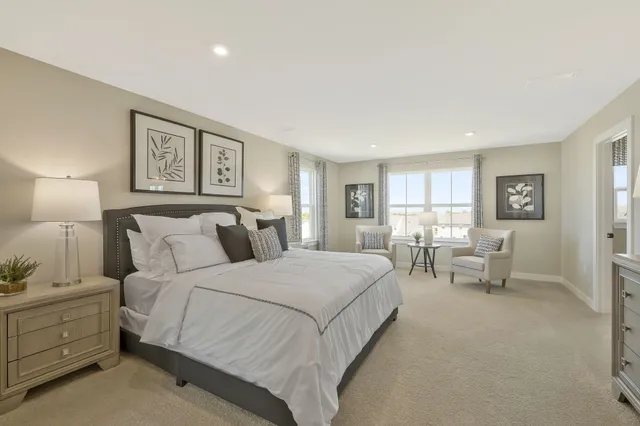 a bedroom with bed and window