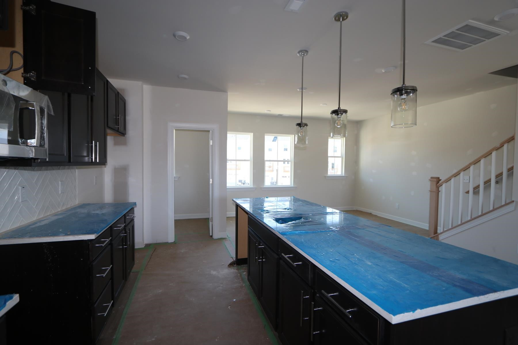 816 Lilyquist Way Wake Forest, NC 27587 - Photo 2 of 6 a kitchen with stainless steel appliances granite countertop a sink stove and refrigerator