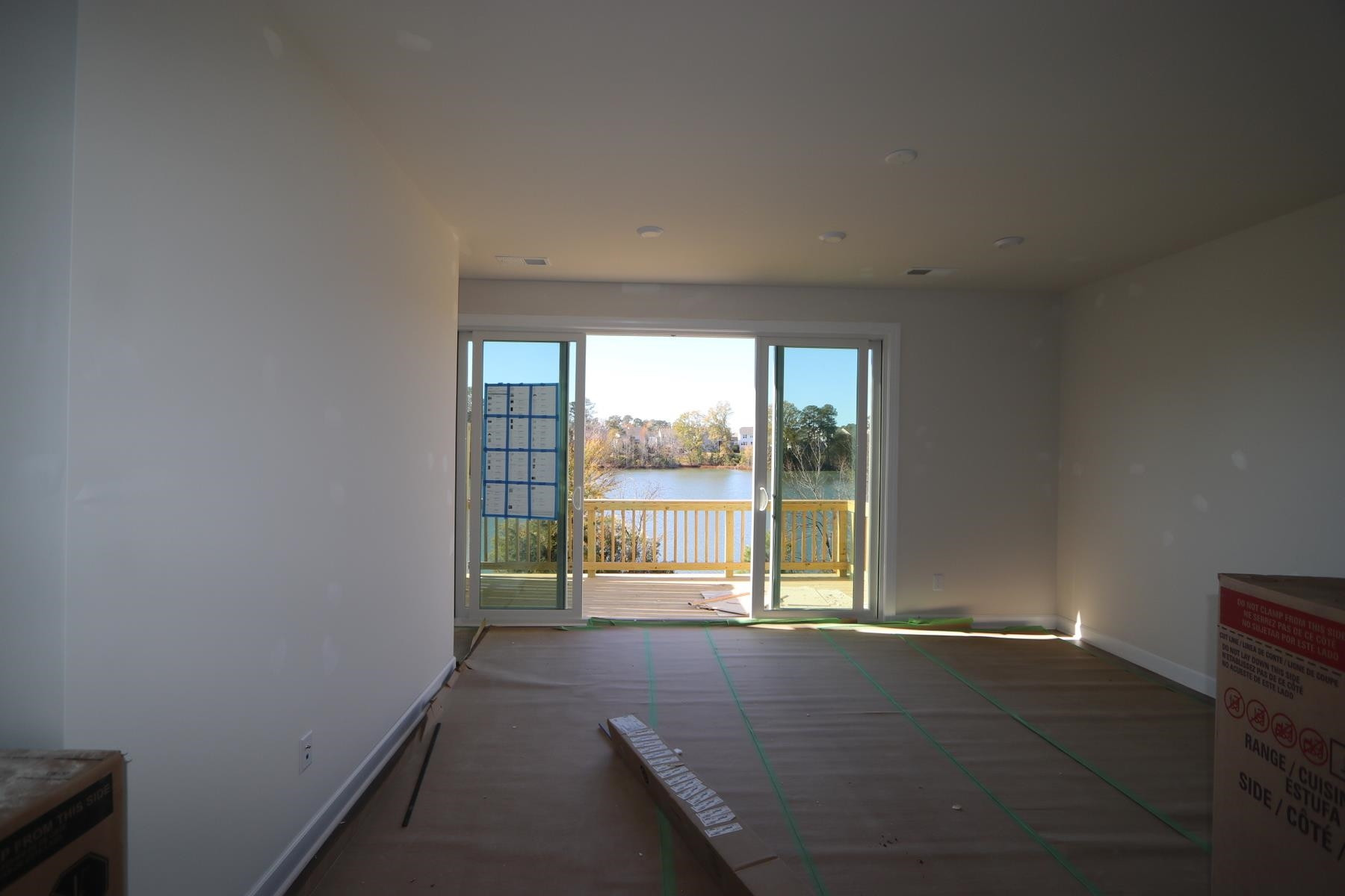816 Lilyquist Way Wake Forest, NC 27587 - Photo 4 of 6 an empty room with large windows