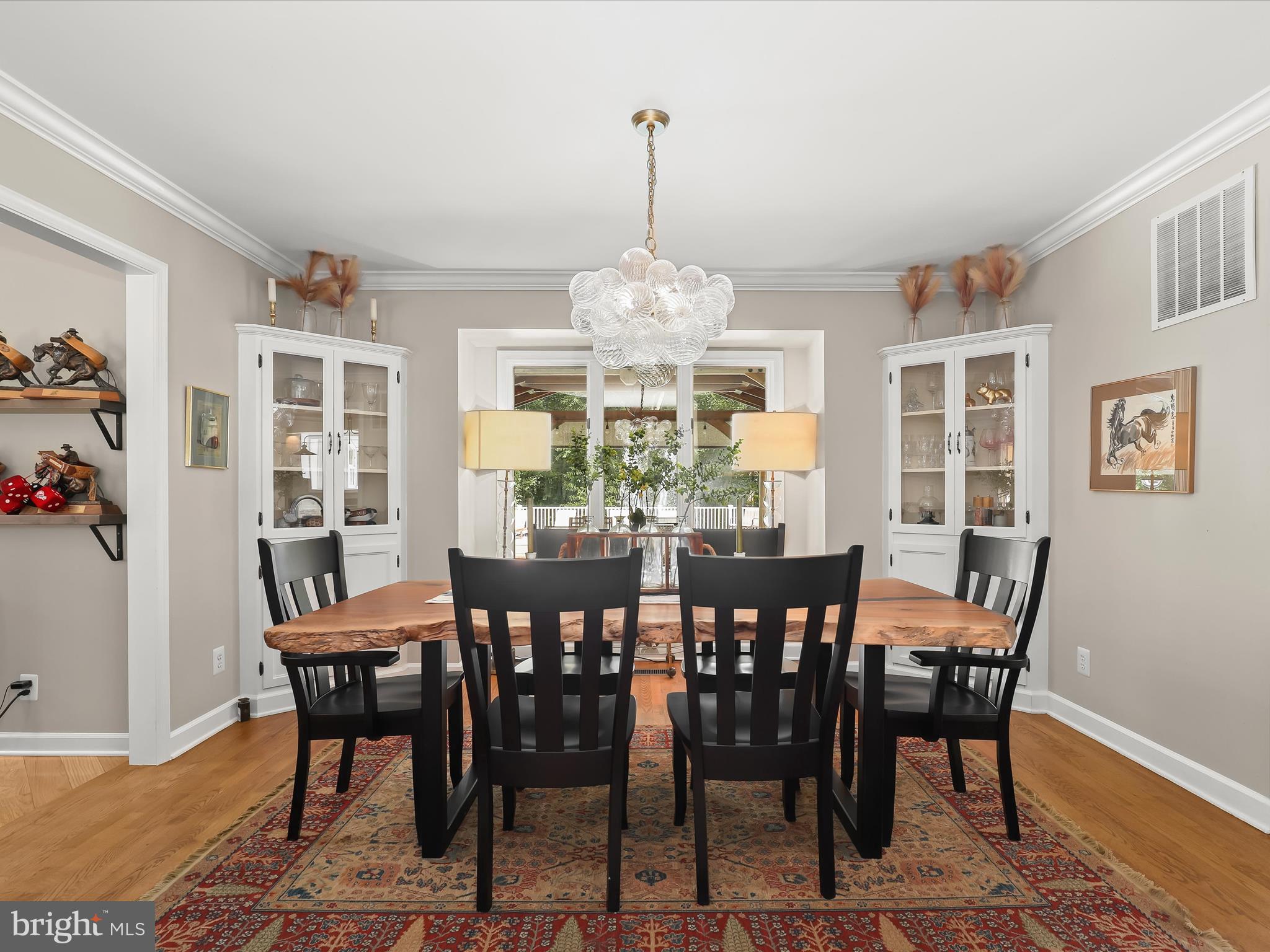 10901 Moxley Road Damascus, MD 20872 - Photo 17 of 148 a view of a dining room with furniture window and wooden floor