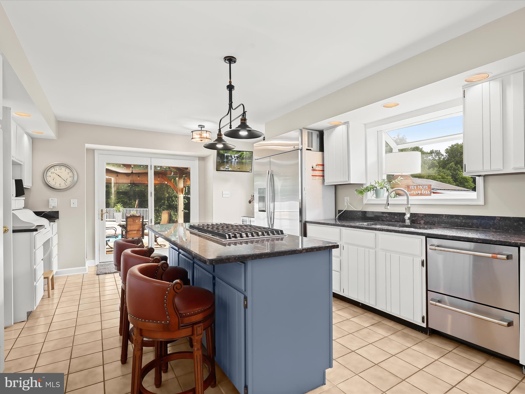 10901 Moxley Road Damascus, MD 20872 - Photo 23 of 148 a kitchen with granite countertop lots of counter top space and dining table