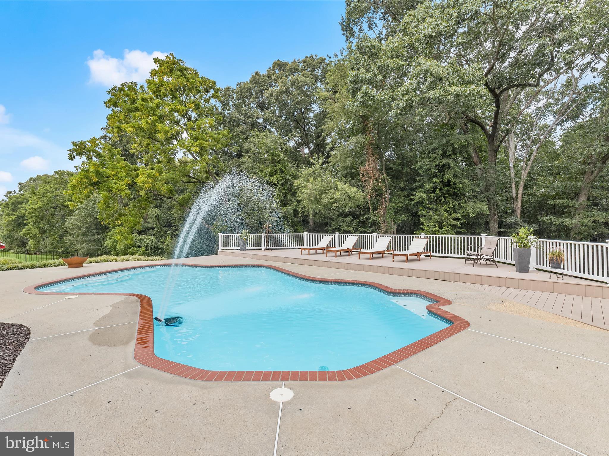 10901 Moxley Road Damascus, MD 20872 - Photo 47 of 148 a view of a swimming pool with an outdoor space