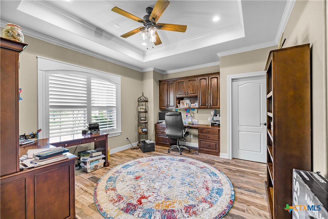 254 Sendera Loop Victoria, TX 77904 - Photo 36 of 48 a view of a workspace with furniture and a window