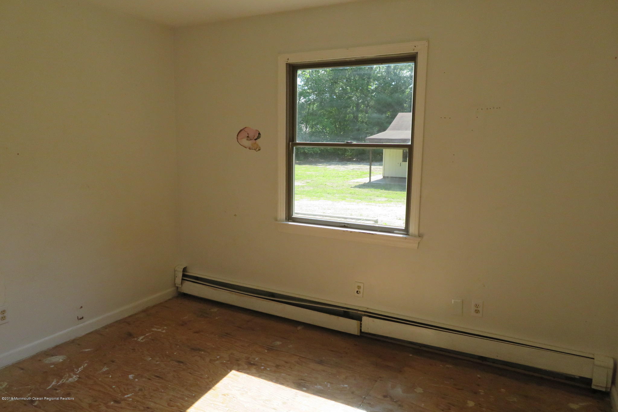 310 Colts Neck Road Farmingdale, NJ 07727 - Photo 12 of 15 an empty room with a window