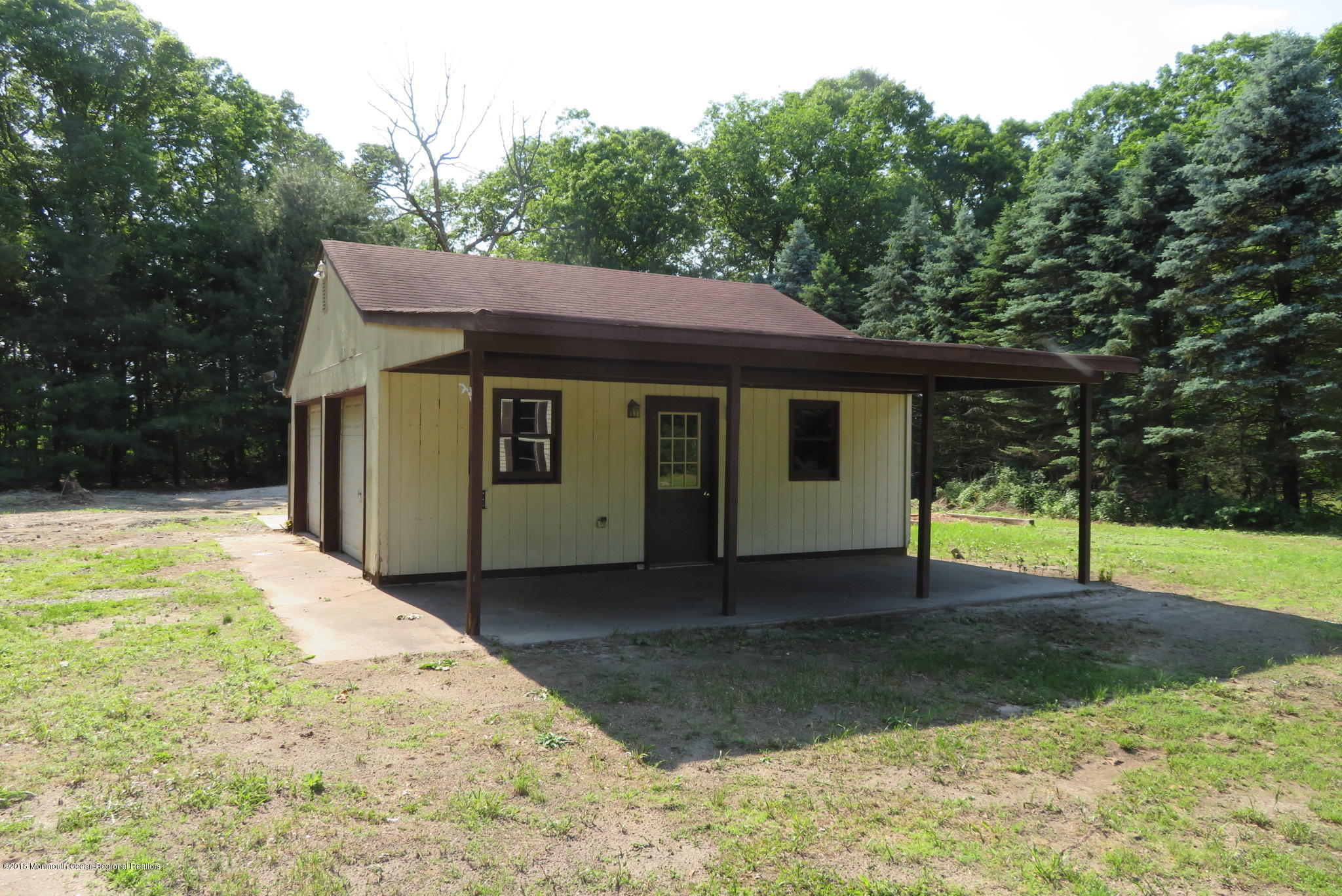 310 Colts Neck Road Farmingdale, NJ 07727 - Photo 13 of 15 a front view of a house with a yard