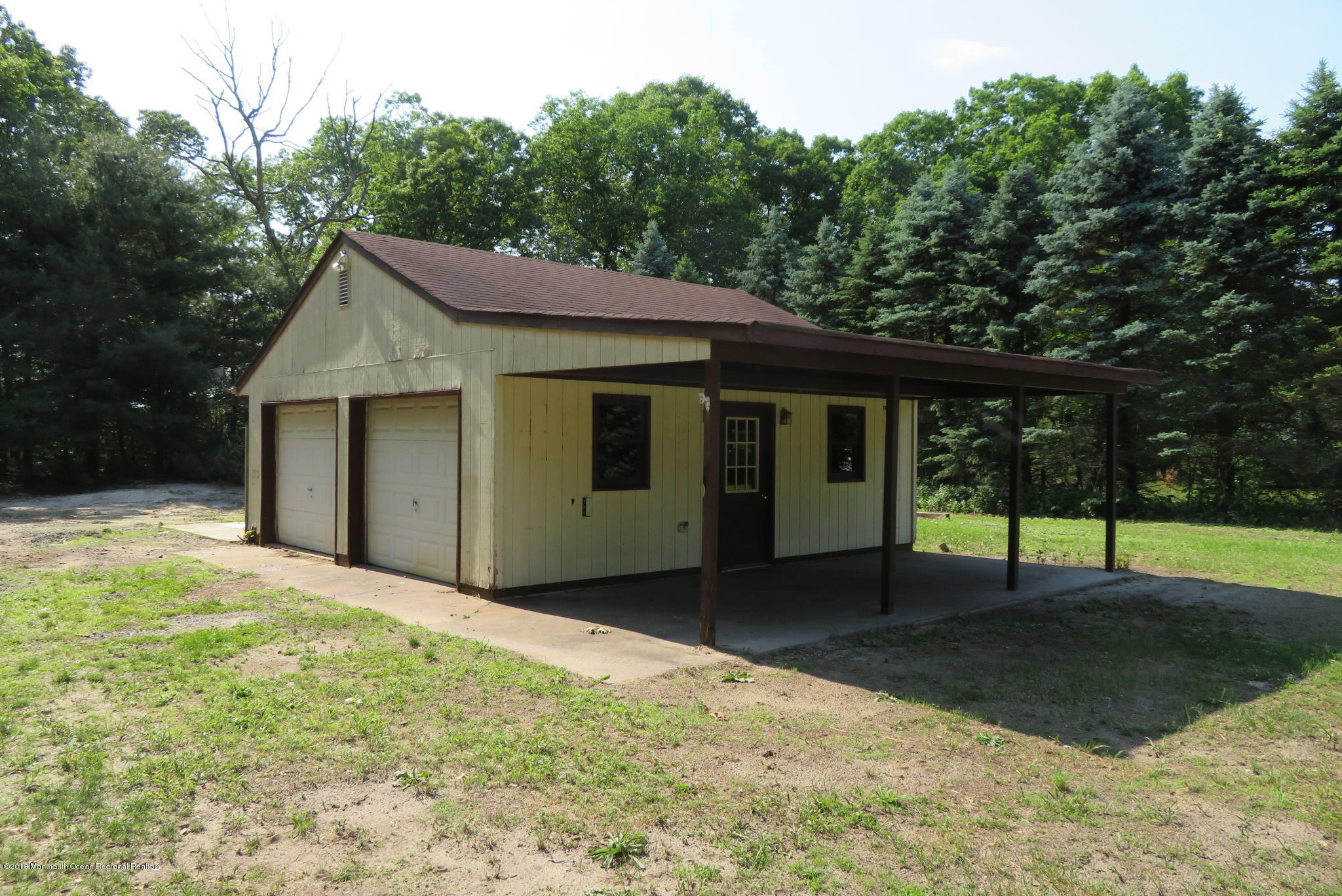 310 Colts Neck Road Farmingdale, NJ 07727 - Photo 14 of 15 a house with yard in front of it