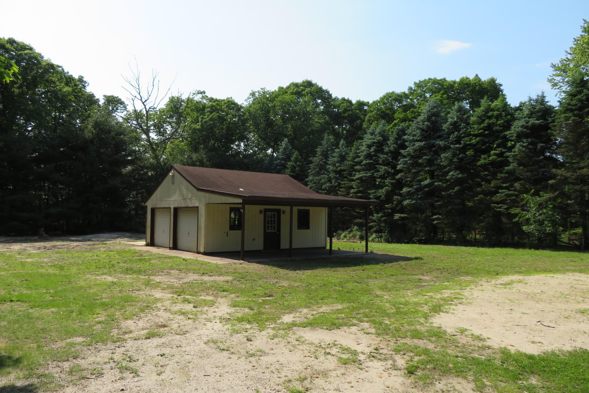 310 Colts Neck Road Farmingdale, NJ 07727 - Photo 15 of 15 a white house with a big yard and large trees