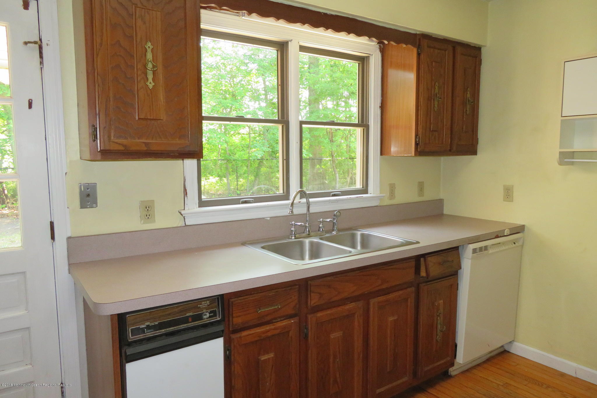 310 Colts Neck Road Farmingdale, NJ 07727 - Photo 3 of 15 a kitchen with a sink and a window