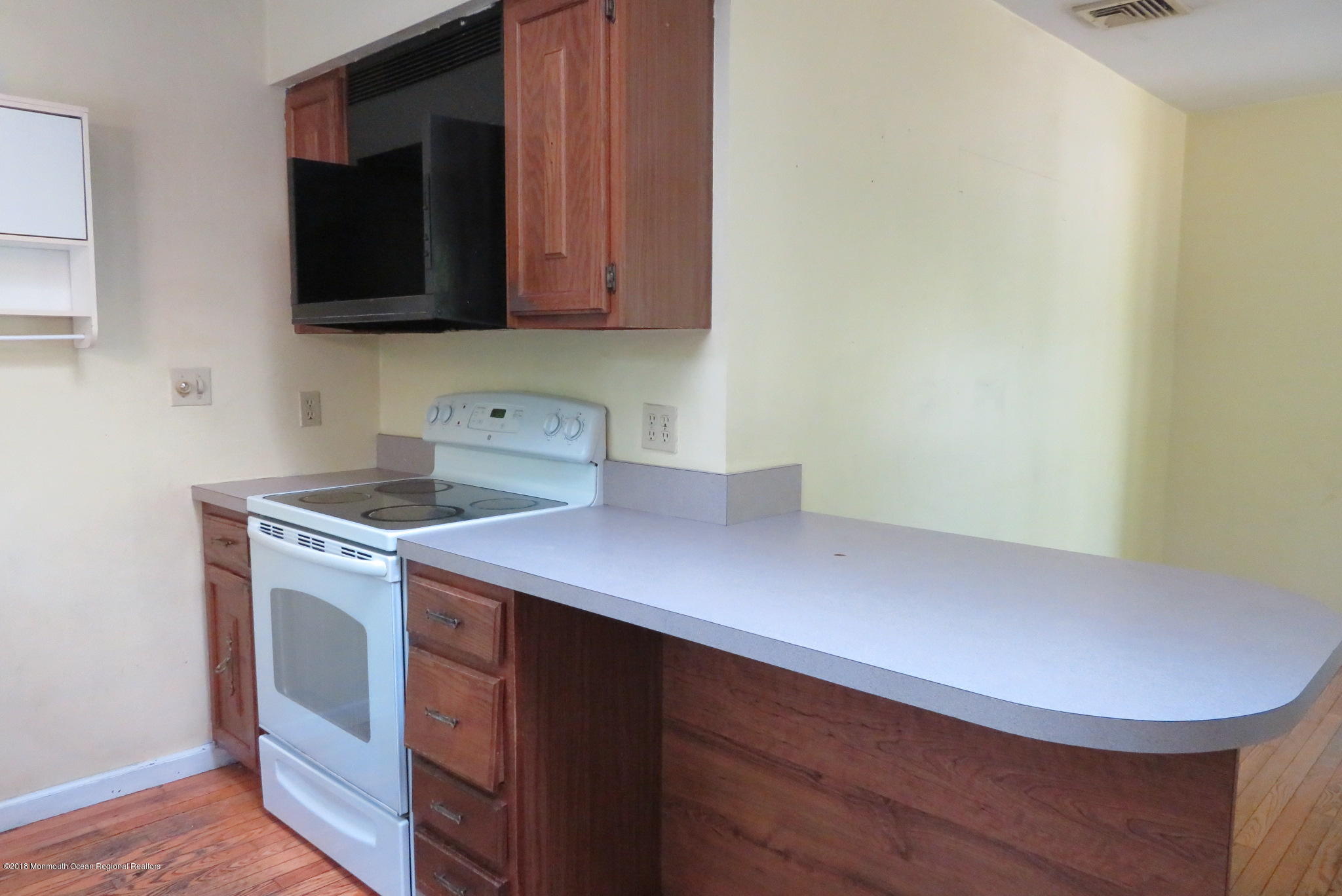 310 Colts Neck Road Farmingdale, NJ 07727 - Photo 4 of 15 a view of a kitchen with sink and microwave