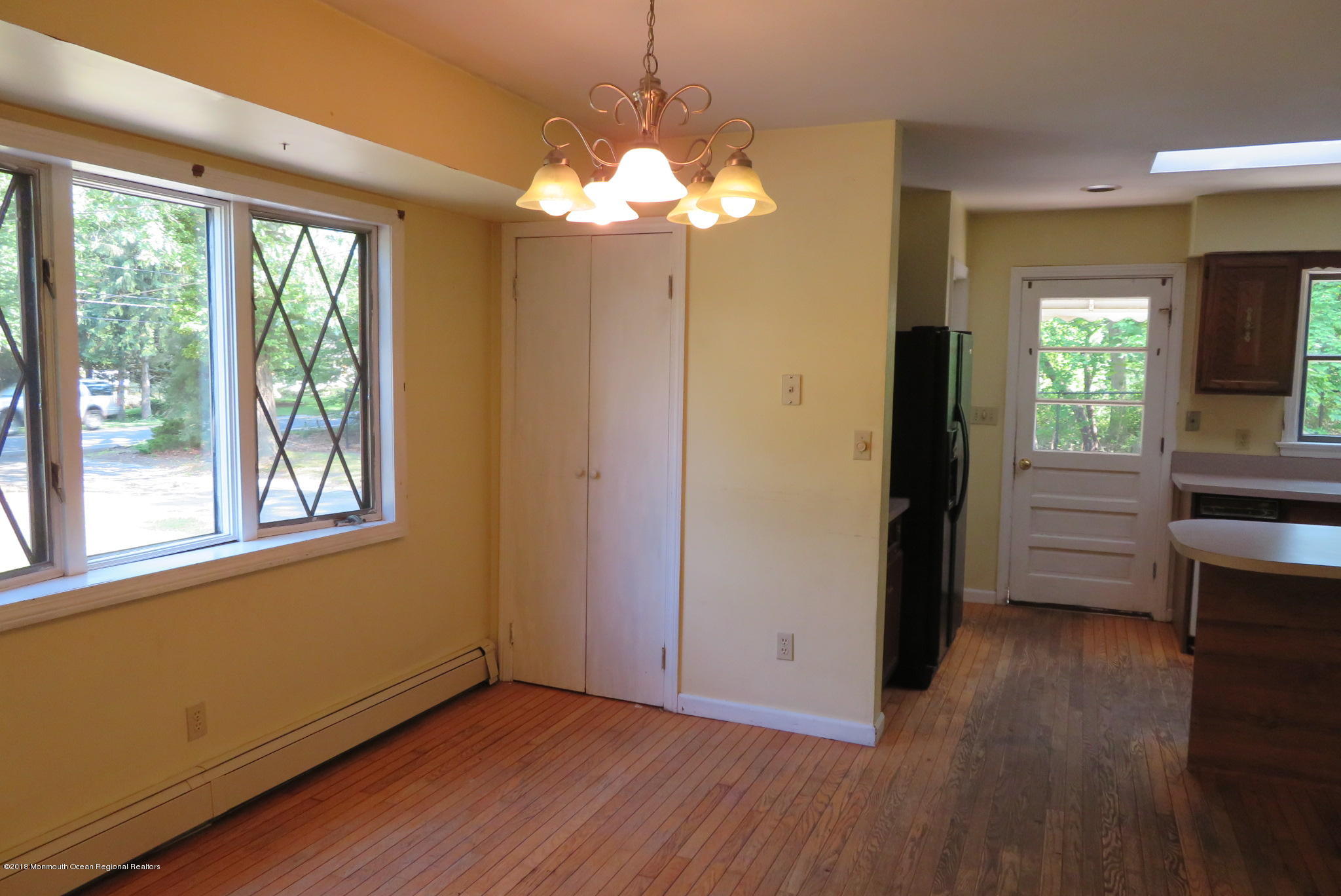 310 Colts Neck Road Farmingdale, NJ 07727 - Photo 5 of 15 a view of livingroom with hardwood floor and window