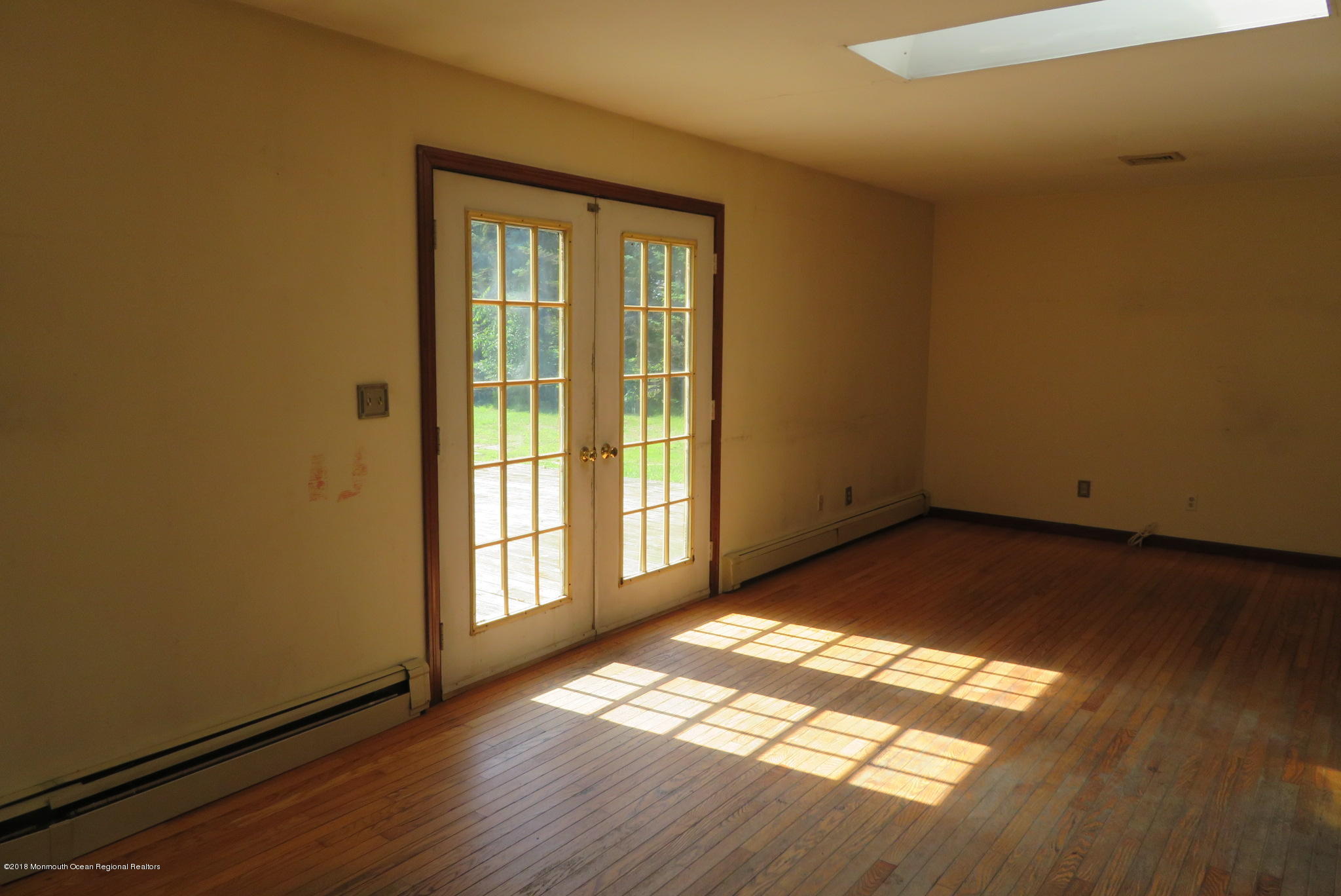 310 Colts Neck Road Farmingdale, NJ 07727 - Photo 7 of 15 a view of empty room with wooden floor