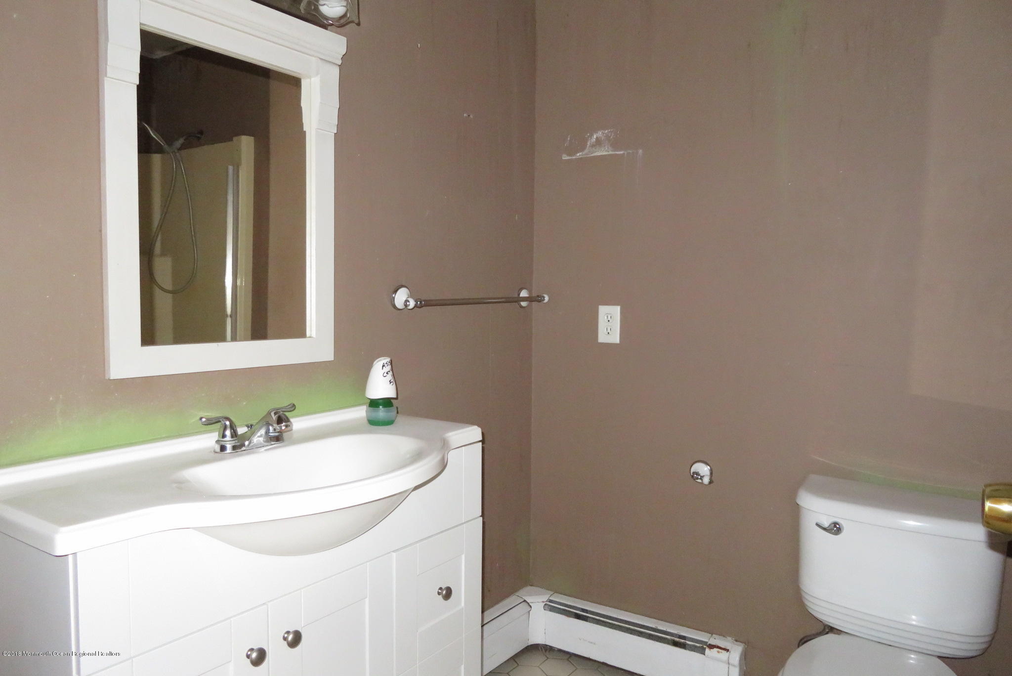 310 Colts Neck Road Farmingdale, NJ 07727 - Photo 9 of 15 a bathroom with a sink and a toilet