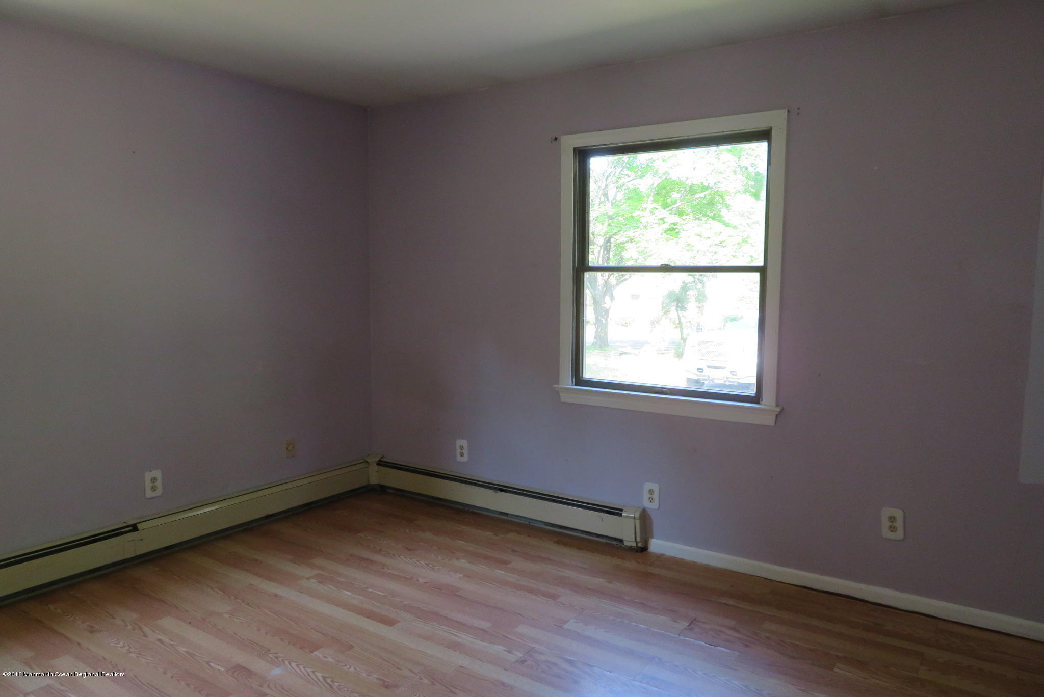 310 Colts Neck Road Farmingdale, NJ 07727 - Photo 10 of 15 an empty room with a window