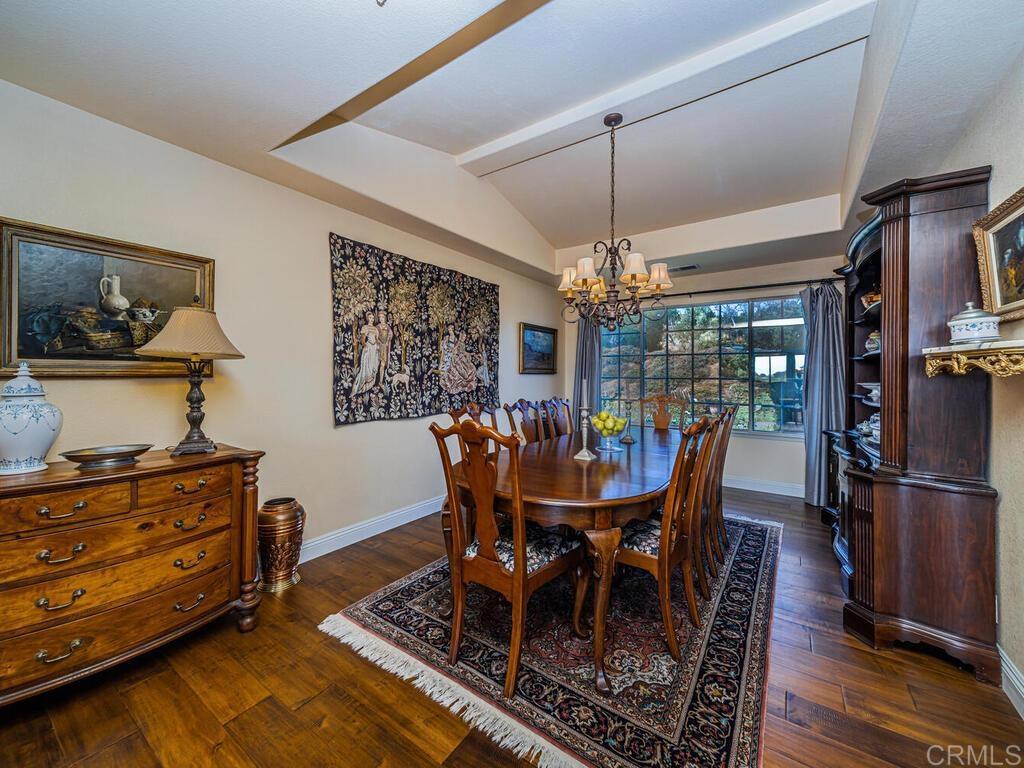 30568 Roadrunner Ridge Valley Center, CA 92082 - Photo 13 of 56 a dining room with furniture window and wooden floor
