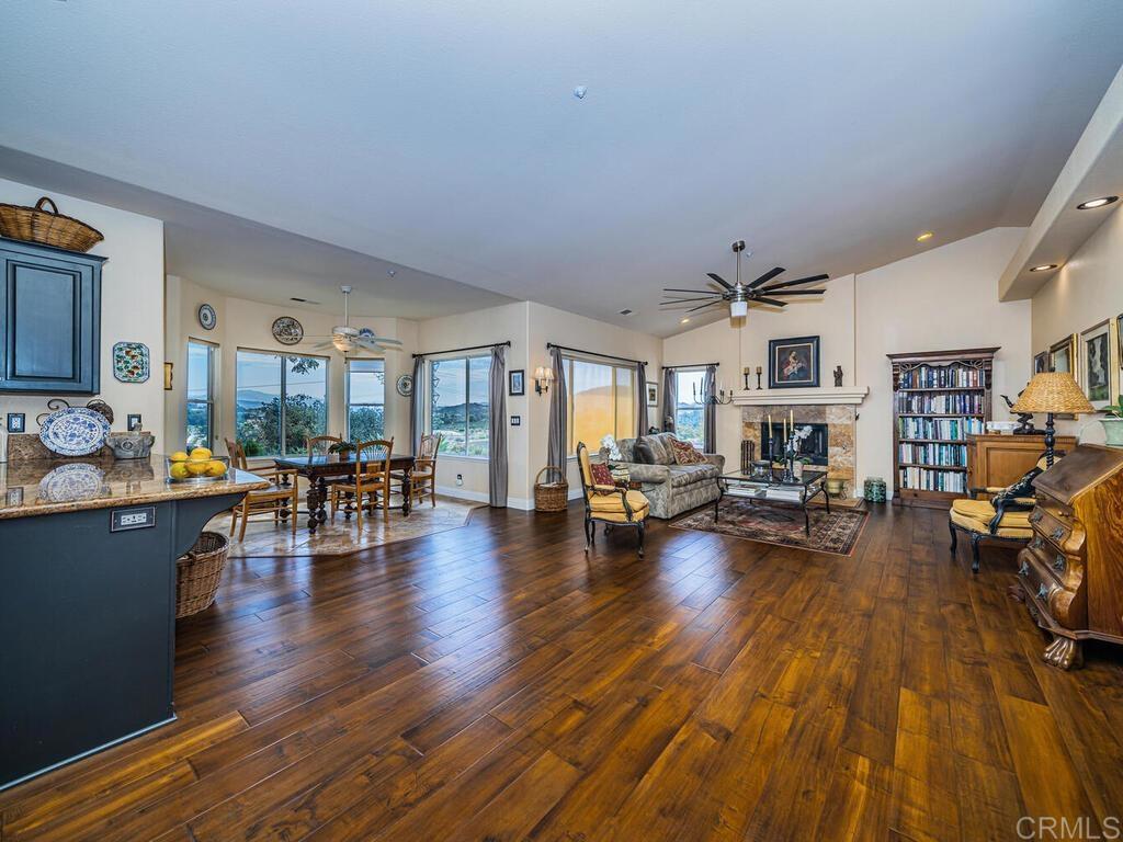 30568 Roadrunner Ridge Valley Center, CA 92082 - Photo 18 of 56 a living room with furniture and a wooden floor