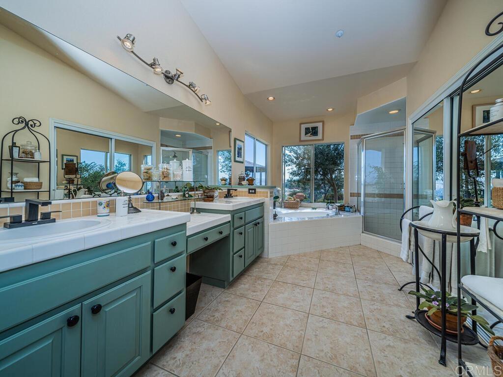 30568 Roadrunner Ridge Valley Center, CA 92082 - Photo 26 of 56 a kitchen with stainless steel appliances granite countertop a sink counter and cabinets