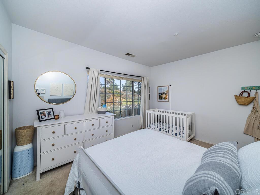 30568 Roadrunner Ridge Valley Center, CA 92082 - Photo 31 of 56 a bedroom with a bed and a dresser