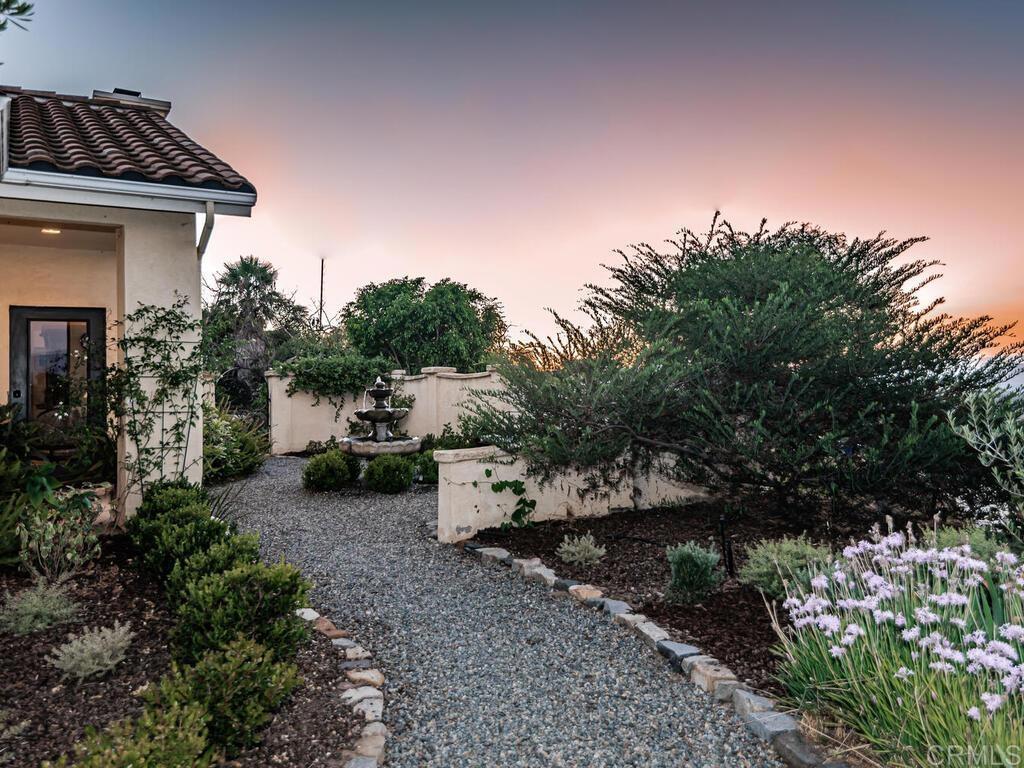 30568 Roadrunner Ridge Valley Center, CA 92082 - Photo 45 of 56 a view of a backyard with plants and a patio