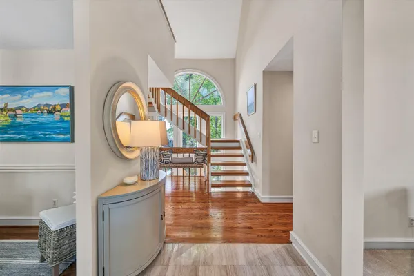 a view of a kitchen with kitchen island a sink a counter top space and living room view