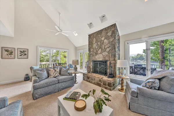a living room with furniture a window and wooden floor