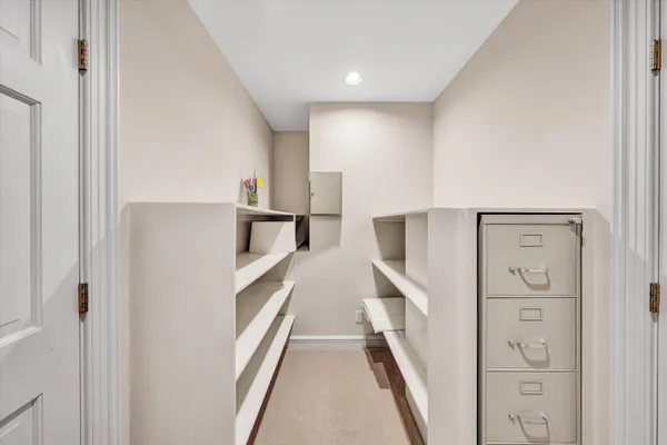 a bedroom with furniture and a dresser