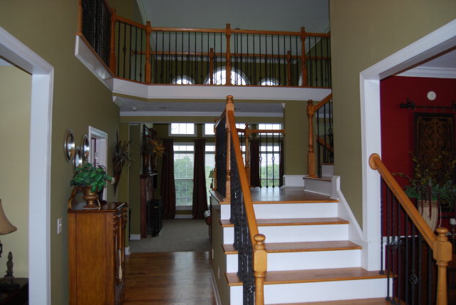 330 Eagle Ridge Road Macon, GA 31216 - Photo 6 of 41 a view of staircase with lots of wooden floor and a chandelier