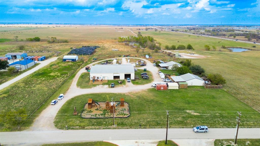 an aerial view of residential houses with outdoor space