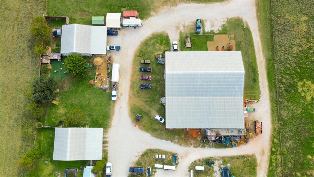 9510 Swafford Road Justin, TX 76247 - Photo 13 of 28 an aerial view of a house with a yard and large trees