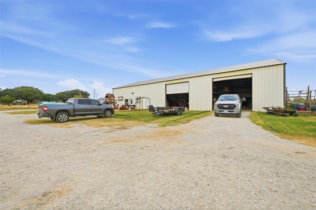 9510 Swafford Road Justin, TX 76247 - Photo 18 of 28 a view of car parked in front of garage